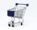 A modern miniature shopping cart on a clean white background, perfect for e-commerce concepts.